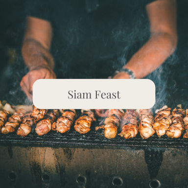 Grilled skewers sizzling on a barbecue with hands working over them.