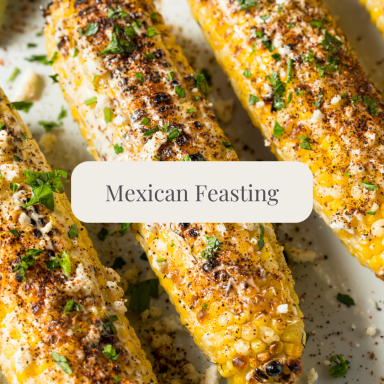 Grilled corn on the cob topped with spices and herbs, labelled "Mexican Feasting."